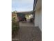 Covered patio area with outdoor seating and a decorative flower bush at 136 N 63Rd St, Mesa, AZ 85205