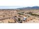 Expansive aerial view of a charming desert property with blue canal and mountain views at 13802 N 186Th Ave, Surprise, AZ 85388