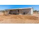 Back exterior of the home featuring desert landscaping and a small patio at 13802 N 186Th Ave, Surprise, AZ 85388