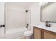 Modern bathroom featuring neutral vanity with a dark faucet and dark fixtures at 13802 N 186Th Ave, Surprise, AZ 85388
