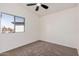 Bedroom featuring carpet and a bright window at 13802 N 186Th Ave, Surprise, AZ 85388
