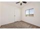 Bedroom with neutral carpet and desert view at 13802 N 186Th Ave, Surprise, AZ 85388
