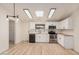 Well-lit kitchen with stainless steel appliances, sleek black hardware, and butcher block counters, a stylish and functional cooking space at 13802 N 186Th Ave, Surprise, AZ 85388