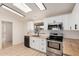 Updated kitchen featuring white cabinets, stainless steel appliances, and butcher block countertops, blending style and functionality at 13802 N 186Th Ave, Surprise, AZ 85388