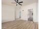 Spacious living room features wood-look floors and an open floor plan at 13802 N 186Th Ave, Surprise, AZ 85388