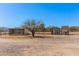 Backyard view showing sheds and desert landscaping at 13802 N 186Th Ave, Surprise, AZ 85388