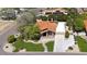 An aerial view of this well landscaped home with a tile roof, sidewalks, and lush green lawn at 1530 E Jeanine Dr, Tempe, AZ 85284