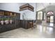 The entertainment area features a custom bar with seating and built-in storage, perfect for gatherings at 1530 E Jeanine Dr, Tempe, AZ 85284