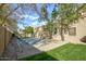 Private backyard basketball court bordered by trees and a tall fence at 1530 E Jeanine Dr, Tempe, AZ 85284