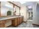 Bathroom featuring a vanity with double sinks, granite countertops, and tile flooring at 1530 E Jeanine Dr, Tempe, AZ 85284