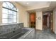 Bathroom featuring a jacuzzi tub with tile surround, sauna, and large window at 1530 E Jeanine Dr, Tempe, AZ 85284