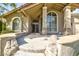 Beige home with stone accents, arched windows, and a beautiful entryway at 1530 E Jeanine Dr, Tempe, AZ 85284