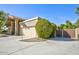 Beige home with a two car garage, desert landscaping, and a private gate at 1530 E Jeanine Dr, Tempe, AZ 85284