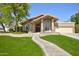 Charming single Gathering home featuring an arched entry, desert landscaping, and two car garage at 1530 E Jeanine Dr, Tempe, AZ 85284