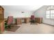 Bright office space with dual desks, ample storage, and a window with shutter at 1530 E Jeanine Dr, Tempe, AZ 85284