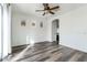 This bedroom features a ceiling fan and a series of small windows providing natural light at 15365 W Valentine St, Surprise, AZ 85379