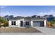 Charming single-story home with desert landscaping and mountain views at 15381 W Cottontail Ln, Surprise, AZ 85387
