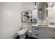 Half bath features elegant gold fixtures, marble accents, and a modern vanity at 16013 N 111Th Pl, Scottsdale, AZ 85255