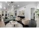 Bright living room boasts modern lighting, stylish furnishings, and elegant decor at 16013 N 111Th Pl, Scottsdale, AZ 85255
