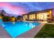 Inviting backyard pool with elegant patio furniture, perfect for outdoor relaxation and entertainment at 16013 N 111Th Pl, Scottsdale, AZ 85255