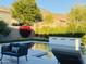 Backyard pool featuring comfortable seating, a serene water feature, and mountain views at 16013 N 111Th Pl, Scottsdale, AZ 85255