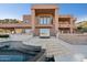 Grand home exterior with stunning multi-level outdoor living spaces and a view of the beautiful yard and mountains at 1721 E Hatcher Dr, Phoenix, AZ 85020