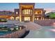 Magnificent exterior view with a stunning infinity pool and outdoor seating, perfect for entertaining guests at 1721 E Hatcher Dr, Phoenix, AZ 85020