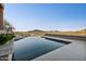 Stunning infinity pool with a picturesque mountain view and desert landscape creating a tranquil outdoor retreat at 1721 E Hatcher Dr, Phoenix, AZ 85020