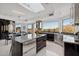 Spacious kitchen with modern appliances, island with barstool seating, and views of the landscape at 1721 E Hatcher Dr, Phoenix, AZ 85020