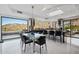 Open-concept kitchen and dining area with views and table that seats six with modern lighting at 1721 E Hatcher Dr, Phoenix, AZ 85020