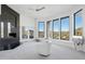 Bright and airy living room featuring a modern fireplace, large windows with scenic views, and comfortable seating at 1721 E Hatcher Dr, Phoenix, AZ 85020