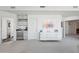 Open living space with white walls showcases modern decor, built-in storage, and seamless bathroom access at 1721 E Hatcher Dr, Phoenix, AZ 85020