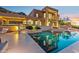 Luxurious outdoor living space with a sparkling pool, inviting lounge area, and sunset views at 1721 E Hatcher Dr, Phoenix, AZ 85020