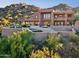 Expansive home exterior with a multi-level patio, pool, and scenic mountain backdrop at 1721 E Hatcher Dr, Phoenix, AZ 85020