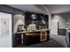 Elegant wet bar with dark cabinetry, granite countertop, and beverage refrigerator at 1721 E Hatcher Dr, Phoenix, AZ 85020