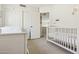 Bright bedroom featuring a crib at 17211 N 46Th Pl, Phoenix, AZ 85032