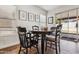 Dining room with a wooden table and chairs, tile floors, and a view of the backyard at 17211 N 46Th Pl, Phoenix, AZ 85032