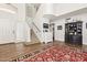 Open entryway boasts a staircase, tile flooring, and a stylish dresser with decorative accents at 17211 N 46Th Pl, Phoenix, AZ 85032