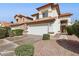Two-story home with a red tile roof, two-car garage, and desert landscaping in the front yard at 17211 N 46Th Pl, Phoenix, AZ 85032