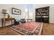 Bright living room features a high ceiling, large windows, and a cozy seating area with an area rug at 17211 N 46Th Pl, Phoenix, AZ 85032