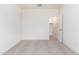 Carpeted bedroom with walk-in closet and neutral color palette at 17648 W Sanna St, Waddell, AZ 85355