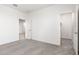 A room with neutral carpet and white walls, providing a blank canvas to create a relaxing space at 17648 W Sanna St, Waddell, AZ 85355