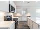 Modern kitchen with quartz countertops and stainless steel appliances at 17648 W Sanna St, Waddell, AZ 85355