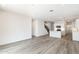 Open concept space with stairs and kitchen featuring an island at 17648 W Sanna St, Waddell, AZ 85355