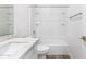 Bright bathroom with white vanity, quartz countertop, and a shower-tub combination at 17704 W Mission Ln, Waddell, AZ 85355