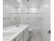 Bathroom featuring double sinks with modern fixtures and a shower-tub combo at 17744 W Hatcher Rd, Waddell, AZ 85355