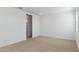 Carpeted bedroom with neutral paint, large closet, and natural light at 17744 W Hatcher Rd, Waddell, AZ 85355