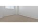 Bedroom featuring neutral carpet and a window at 17744 W Hatcher Rd, Waddell, AZ 85355