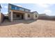 Expansive backyard featuring a covered patio and plenty of space for customization at 17788 W Getty Dr, Goodyear, AZ 85338