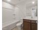 Bathroom features a shower-tub combo and vanity at 17788 W Getty Dr, Goodyear, AZ 85338
